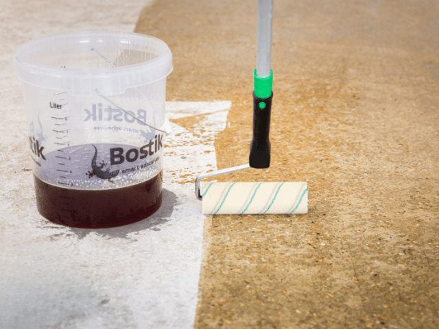 roller and bostik product side by side on subfloor