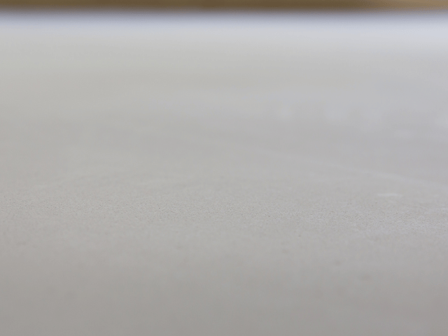Smooth and level concrete floor surface after preparation using Bostik floor repair and levelling system.