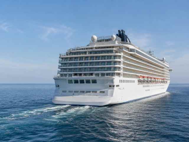 Large cruise ship sailing across calm open water, illustrating marine environments where Bostik adhesive, sealing and flooring solutions are used on passenger vessels.