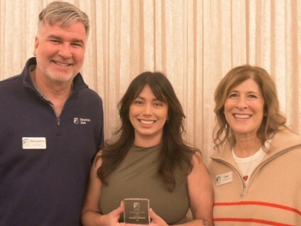Monica is flanked by Ben Jones, Vice President of Conservation and Education, on the left, and Lisa Peterson, President and CEO of the Zoo, on the right