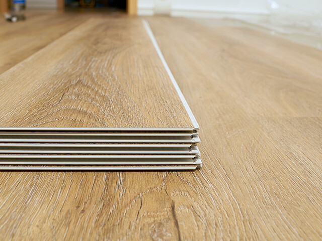 Floor covered with vinyl tiles, illustrating Bostik’s adhesives for durable and efficient flooring installation.